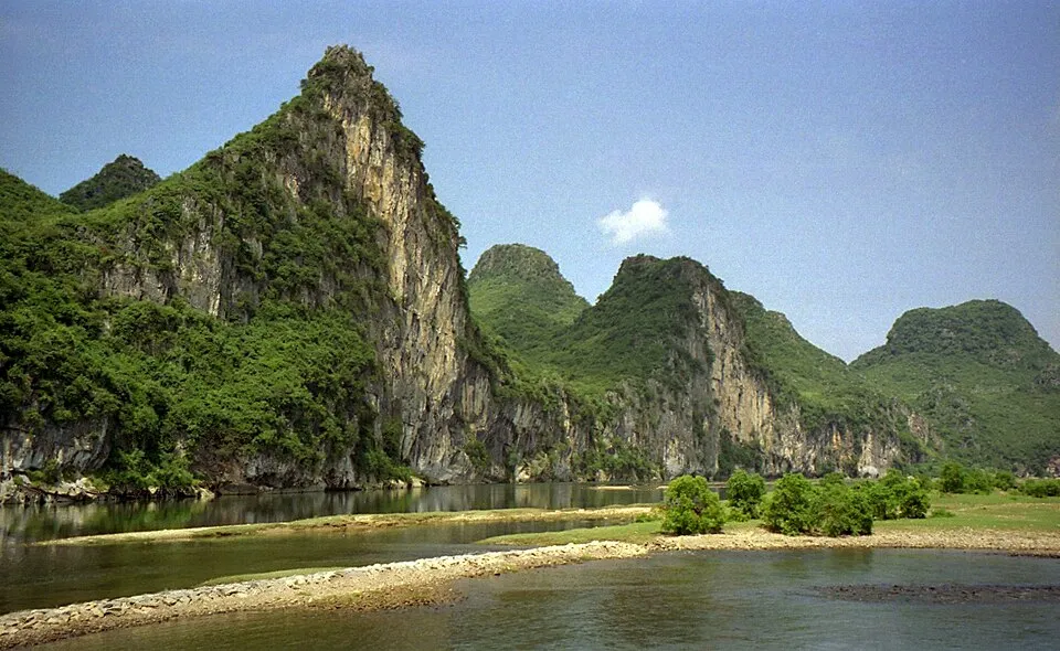 Forested limestone peaks beside the Li River between Guilin and Yangshuo
