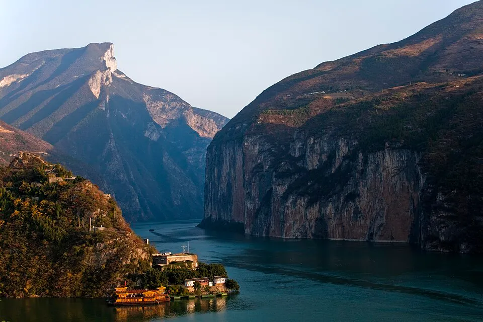 The Yangtze River passing between the cliffs of Qutang Gorge, viewed from Baidi City