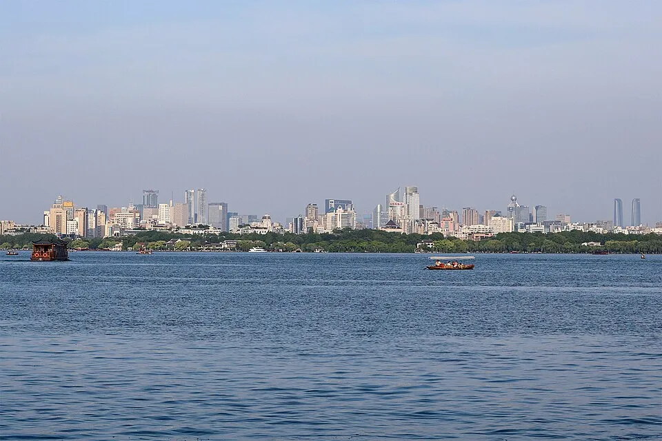 West Lake and the Hangzhou skyline beneath green hills
